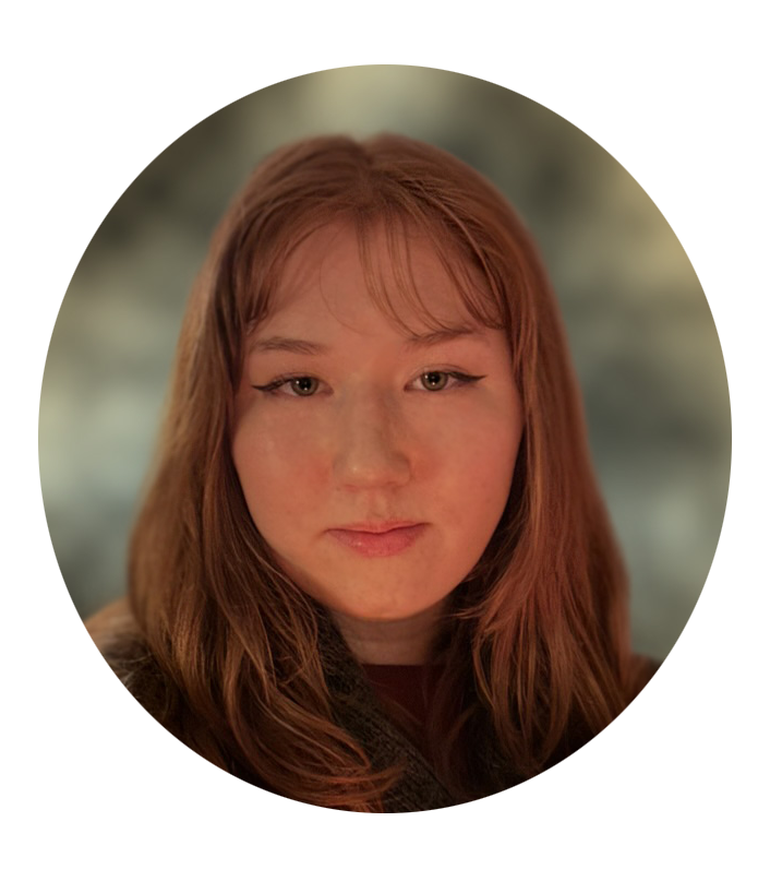 photo of a person with orange hair and glasses